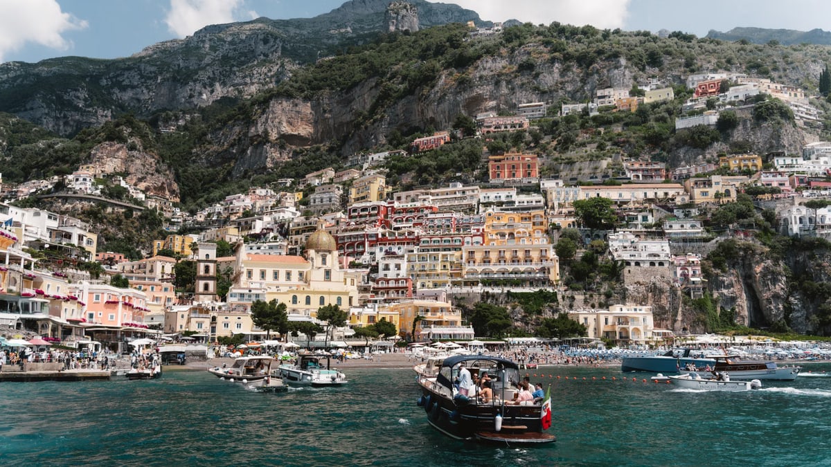 Experience the vibrant colors and charming architecture of Positano along the stunning Amalfi Coast in Italy.